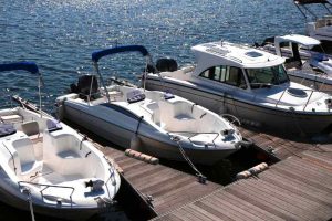 Pleasure boats docked at the pier of a Lake of the Ozarks marina